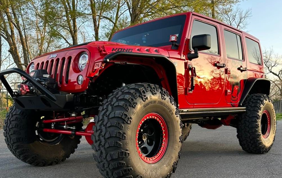 Red vehicle after professional paint correction and detailing