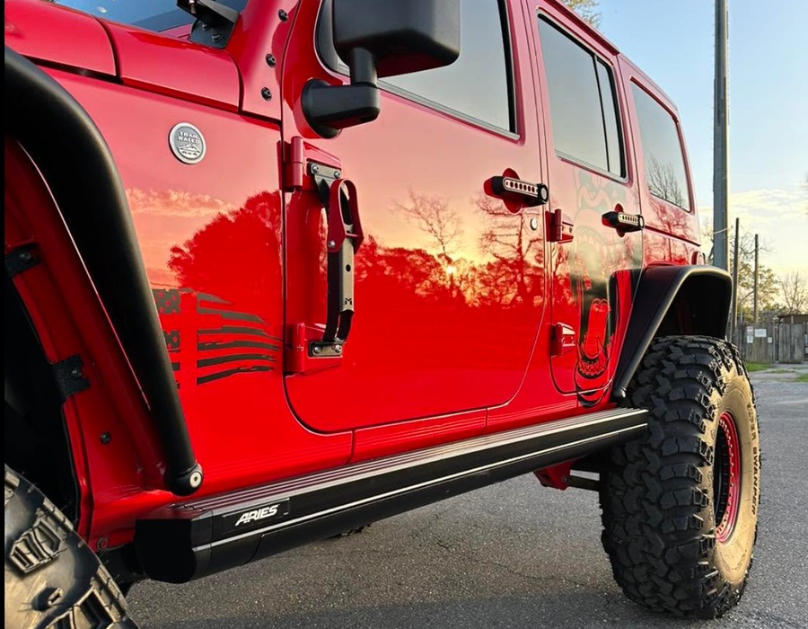Lifted red Jeep after exterior detailing